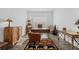 Cozy home office with a rustic desk and a comfortable leather chair, ideal for focused work sessions at 8982 Baroque Ter, Sarasota, FL 34240