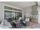 Outdoor kitchen and entertainment space with grill and view of the swimming pool at 8982 Baroque Ter, Sarasota, FL 34240