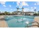 Community pool with ample lounge seating, gazebo, and a well-maintained pool deck for relaxation and socializing at 8982 Baroque Ter, Sarasota, FL 34240