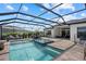 Relaxing pool area with a spa, comfortable lounge chairs, outdoor seating, and lush landscaping in a screened enclosure at 8982 Baroque Ter, Sarasota, FL 34240