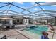 Inviting pool area with comfortable outdoor seating, dining area, and ample space for relaxation and entertainment at 8982 Baroque Ter, Sarasota, FL 34240