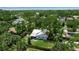 A beautiful aerial view of the property nestled among lush greenery, in a quiet neighborhood at 951 Varet Rd, Venice, FL 34293
