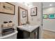 Charming bathroom with a stylish vanity and a decorative mirror, perfect for guests at 951 Varet Rd, Venice, FL 34293