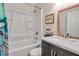 Bathroom with marble countertops and updated tub and shower combination at 951 Varet Rd, Venice, FL 34293