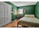 Cozy bedroom features hardwood floors, closet, and a soft bed at 951 Varet Rd, Venice, FL 34293
