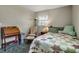 Quaint bedroom featuring a comfortable bed, desk, and hardwood flooring at 951 Varet Rd, Venice, FL 34293