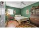 Well decorated bedroom with hardwood floors, vintage furniture, and ambient lighting at 951 Varet Rd, Venice, FL 34293