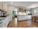 Spacious kitchen with white cabinets, modern appliances, and a view of the breakfast nook and Gathering room at 951 Varet Rd, Venice, FL 34293
