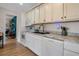 Clean kitchen featuring white appliances and cabinets, complemented by modern countertops and fixtures at 951 Varet Rd, Venice, FL 34293