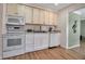 Bright kitchen with white cabinets, modern appliances, and efficient design for cooking and cleanup at 951 Varet Rd, Venice, FL 34293
