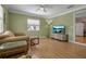 Cozy living room with wood floors, and lots of natural light at 951 Varet Rd, Venice, FL 34293