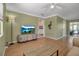 Relaxing living room with hardwood floors, TV, and open floor plan at 951 Varet Rd, Venice, FL 34293