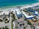 Aerial view showcases beachfront condo buildings, pool, parking and beautiful beaches at 1001 Point Of Rocks Rd # 207, Sarasota, FL 34242