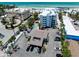 Aerial view of beachside condos, pool, and parking at an upscale Gulf Coast property at 1001 Point Of Rocks Rd # 207, Sarasota, FL 34242