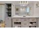 Bathroom featuring a double sink vanity, lots of storage, and great lighting at 1001 Point Of Rocks Rd # 207, Sarasota, FL 34242