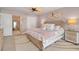 The bedroom features stylish coastal decor, a decorative fan, and a comfortable bed at 1001 Point Of Rocks Rd # 207, Sarasota, FL 34242