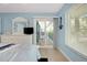 The bedroom features a view of the lanai, plus a decorative nautical theme at 1001 Point Of Rocks Rd # 207, Sarasota, FL 34242