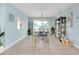 Inviting dining room with light blue walls and stylish decor creates a serene atmosphere for meals at 1001 Point Of Rocks Rd # 207, Sarasota, FL 34242