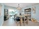 The dining room features modern decor, patio access and storage, providing a stylish and functional space at 1001 Point Of Rocks Rd # 207, Sarasota, FL 34242