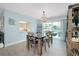 Bright dining area with a view through a pass-through to the kitchen, features seating for six guests at 1001 Point Of Rocks Rd # 207, Sarasota, FL 34242