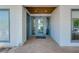 Inviting front entrance featuring a glass door, transom and sidelight at 1001 Point Of Rocks Rd # 207, Sarasota, FL 34242