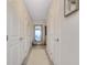 Hallway with tile floors leading to a mirror and the ocean view at 1001 Point Of Rocks Rd # 207, Sarasota, FL 34242