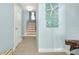 Hallway with decorative starfish and beach-themed decor leading to staircase at 1001 Point Of Rocks Rd # 207, Sarasota, FL 34242