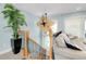 Upstairs living room features a ceiling fan, nice hardwood floors and a staircase to the first floor at 1001 Point Of Rocks Rd # 207, Sarasota, FL 34242