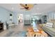 Relax in this stylish living room featuring tile floors, beach decor, and easy access to kitchen and dining at 1001 Point Of Rocks Rd # 207, Sarasota, FL 34242