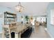 An open-concept layout connects the dining area with the living room and access to the upstairs bedrooms at 1001 Point Of Rocks Rd # 207, Sarasota, FL 34242