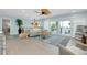 Open-concept living area with tile flooring, modern decor, and a sliding glass door to the outside at 1001 Point Of Rocks Rd # 207, Sarasota, FL 34242
