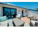 Spacious rooftop deck with lounge furniture offers a relaxing outdoor space with palm tree views at 1001 Point Of Rocks Rd # 207, Sarasota, FL 34242