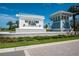 Welcoming entrance to Mallory Park at Lakewood Ranch features a decorative sign, lush landscaping, and a charming information center at 11502 Golden Bay Pl, Bradenton, FL 34211