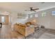 Inviting living room with wood-look tile flooring, shiplap accent wall, and an abundance of natural light at 11502 Golden Bay Pl, Bradenton, FL 34211
