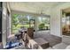 Covered patio with dining furniture and screened-in enclosure, perfect for enjoying outdoor living at 11502 Golden Bay Pl, Bradenton, FL 34211