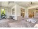 Inviting outdoor patio with dining set, lounge chairs, and string lights, perfect for relaxing and entertaining at 11502 Golden Bay Pl, Bradenton, FL 34211