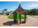Whimsical gazebo with shaded seating complements the playground, offering a charming rest area at 11502 Golden Bay Pl, Bradenton, FL 34211