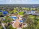 Expansive aerial view of community amenities including a playground, water features, and lush green landscaping at 11714 Forest Park Cir, Bradenton, FL 34211