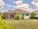 Well-manicured backyard with a screened-in patio and lush landscaping at 11714 Forest Park Cir, Bradenton, FL 34211