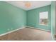 Bright bedroom with green walls and a window at 11714 Forest Park Cir, Bradenton, FL 34211