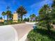 Residents-only entrance with palm trees, manicured landscaping and gated access at 11714 Forest Park Cir, Bradenton, FL 34211