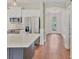 Open kitchen view featuring modern appliances, granite countertops, and hardwood flooring at 11714 Forest Park Cir, Bradenton, FL 34211