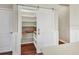A pantry features a sliding barn door and custom shelving for maximum storage capacity at 11714 Forest Park Cir, Bradenton, FL 34211