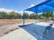 Community playground with covered seating area and ample space for children to play and enjoy outdoor activities at 11714 Forest Park Cir, Bradenton, FL 34211