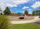 Community playground with play structures and covered seating areas, perfect for families at 11714 Forest Park Cir, Bradenton, FL 34211