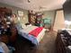 View of a bedroom with dark tile flooring and unique decor, including a fish tank at 12127 Hunter Ave, Port Charlotte, FL 33953