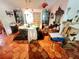 Dining room featuring terra cotta tile floors, unique furnishings, and an adjacent sitting area at 12127 Hunter Ave, Port Charlotte, FL 33953