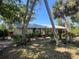 A home surrounded by greenery, showcasing privacy, natural light, and peaceful outdoor living spaces at 12127 Hunter Ave, Port Charlotte, FL 33953