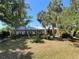 Lovely home with mature trees and abundant greenery creates a tranquil setting at 12127 Hunter Ave, Port Charlotte, FL 33953