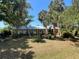 Lovely home with mature trees and abundant greenery creates a tranquil setting at 12127 Hunter Ave, Port Charlotte, FL 33953